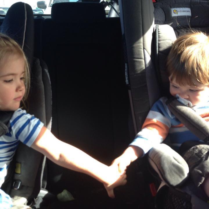 Siblings holding hands